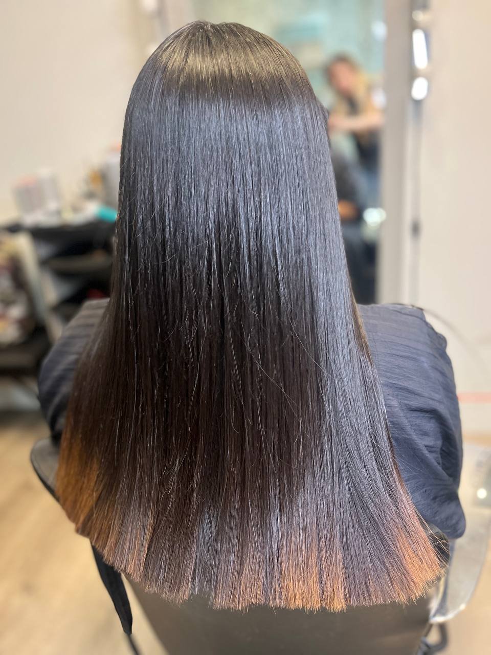 Glossy straight brunette hair